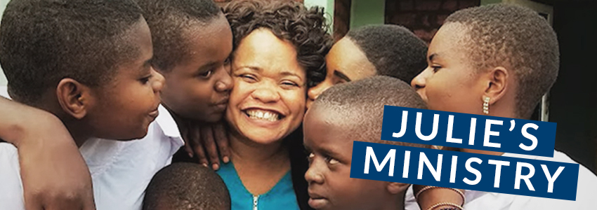 Julie Mapatano surrounded by Congolese orphans.