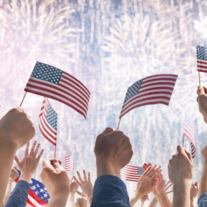 Fireworks with hands holding flags - Truth and Liberty Awards Blog- Image